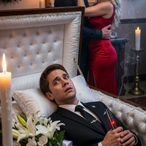 At my funeral, paralyzed inside my coffin, I caught my wife and my private doctor kissing and planning to cremate me alive. The furnace roared. I had minutes left. They thought they’d won. Suddenly, my brother burst in, clutching something salvaged from my mansion’s trash. He roared a single sentence, and my “grieving” wife went dead pale.