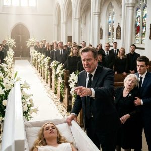 I stood by my pregnant wife’s coffin, trying to play the “strong widower” while our unborn child slept forever inside her. “Just let me look at her one last time,” I whispered to the funeral director. The room was dead silent as I leaned over the casket. Suddenly, her swollen belly shifted. Not a shadow. Not a trick of my grief. A violent kick. I froze in absolute hope. But the my mother went deadly pale…