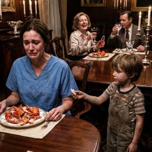 After a brutal 12-hour shift, I came home to find my mother-in-law had already “sorted dinner.” My five-year-old sat quietly at the table with a bowl of cold rice, while the rest of the family laughed over the $300 lobsters I had paid for. The empty shells on my plate were stacked neatly like an insult. “The meat was for real family,” Carol said without looking up, calmly cracking another claw. My son tugged my sleeve, then slowly opened his palm under the table—inside was a tiny, lint-covered shred of lobster wrapped in a napkin. “It fell on the floor,” he whispered. “I hid it for you, Mommy.” I didn’t speak. I just let the plate fall from my hand and smash against the floor. Then I took my son, wiped his hands, and walked out while the shellfish sauce still dripped from their forks. By sunrise, they were on their knees, begging, because….