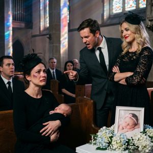 My daughter’s funeral became a nightmare the moment my husband walked in with his mistress. Glaring at the surviving twin boy sleeping in my arms, he spat, “You dirty b//itch. God took the girl because a pathetic, defective woman like you never deserved to be a mother.” He stepped closer, his voice dropping to a low hiss. “Hand my son over to his real mother, or I swear you’ll be buried right next to this one.” When I refused, he sla//pped me so hard that my face sma//shed against the tiny casket. Bl00d filled my mouth, but I didn’t scream. I didn’t call the police. They smirked in triumph, believing I was just a shattered, helpless wife about to lose her last child. They were completely unaware that what I was about to do next would…”
