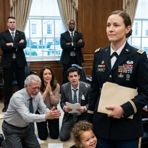 At a family dinner, my husband’s cousin—a lieutenant—smirked. “You’re in the Navy? Let me guess—your main job is posing for recruitment posters.” Then his father looked at me and asked, “What’s your callsign?” The room went dead silent.